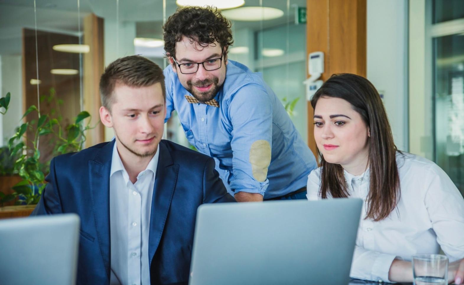 Person analyzing financial data with focused concentration